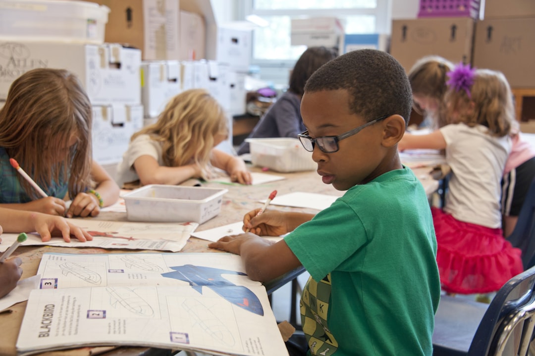 Services Captured in a metropolitan Atlanta, Georgia primary school, seated amongst his classmates, this photograph depicts a young African-American schoolboy who was in the process of drawing with a pencil on a piece of white paper. Note that the student was focused on a drawing book that referenced fantasy flying planes, while intent on creating his artwork, seemingly oblivious to all the classroom goings-on that surrounded him. It is important to know that objects, including pencils, crayons, paper, etc., are known as fomites, and can act as transmitters of illnesses.